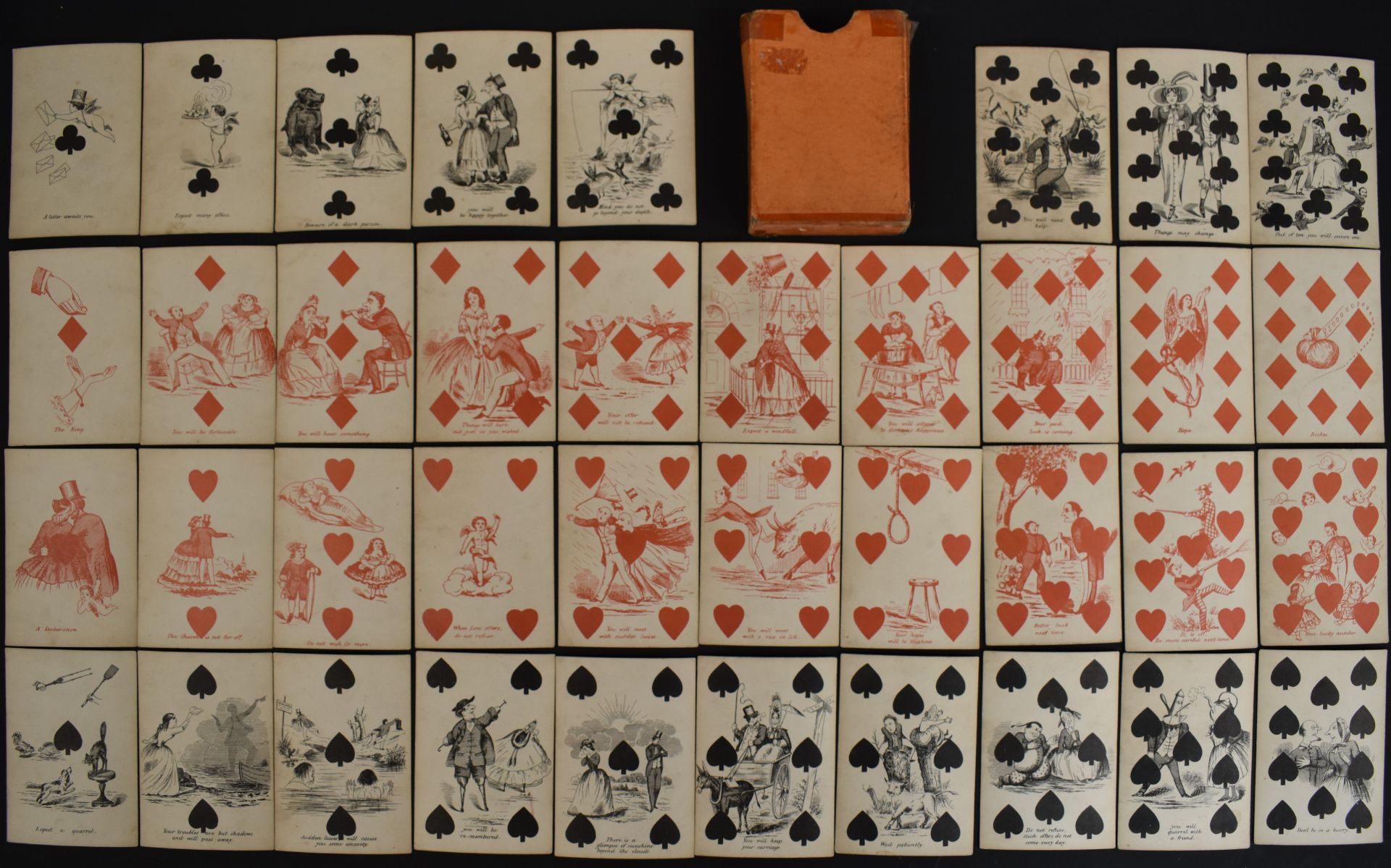 19th or early 20th century pack of transformation fortune telling playing cards with pink backs (
