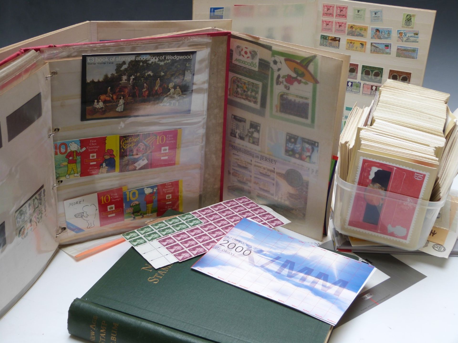 A collection of stamp albums including mint unused stamp booklets, lots of first class, Rupert