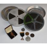 Mickey Mouse Cats Away 16mm cine film, The Sawdust Ring 16mm cine film and various medallions and