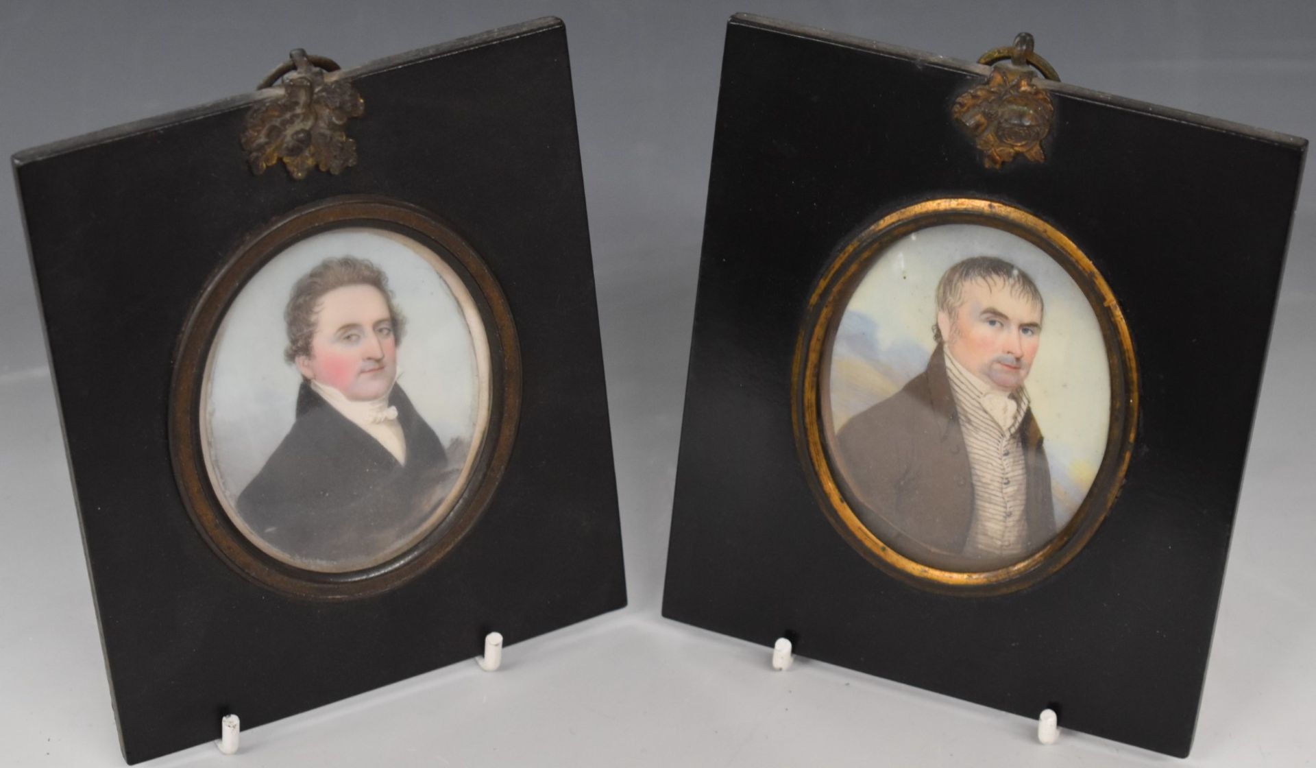 Two 19thC portrait miniatures of gentlemen, in ebonised frames with gilt mounts, size of portraits 7