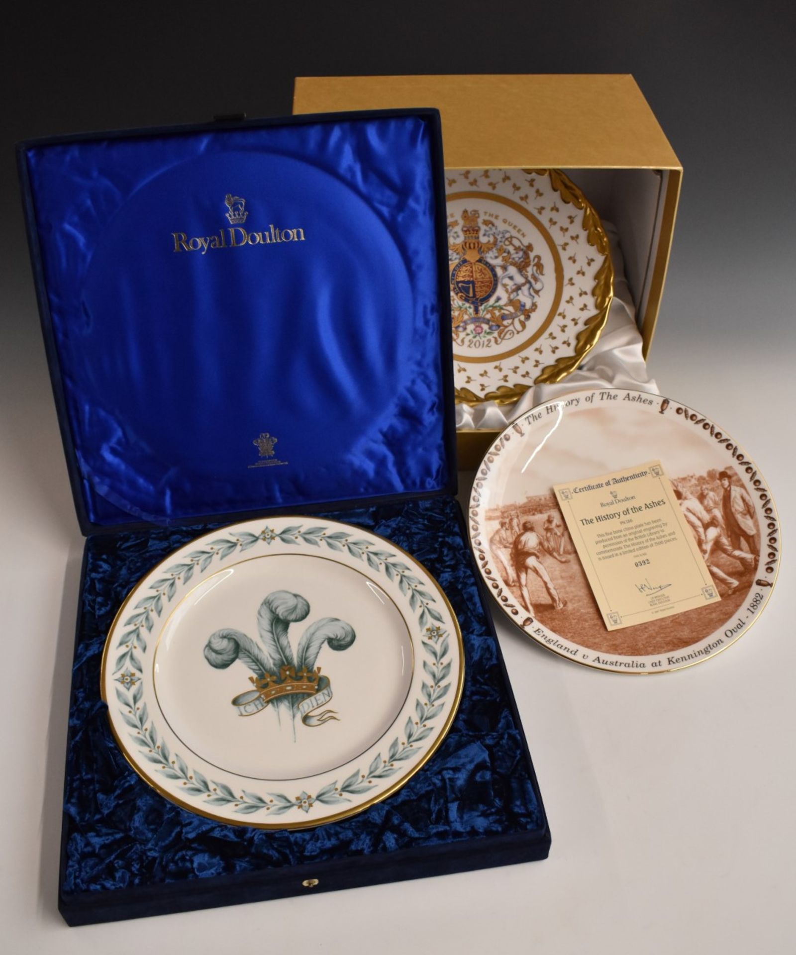 Royal Doulton cabinet plate hand decorated with Prince of Wales feathers, gilt inscription verso '