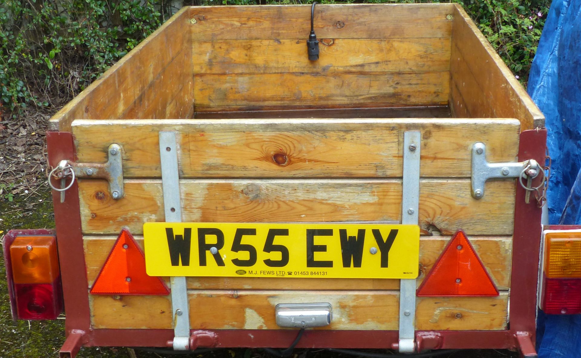 Small car trailer with wooden body sides