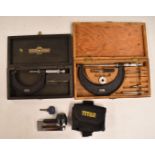 Two cased Moore & Wright micrometers, 0-4 inch and 2-3 inch and an Oxford Titan motorcycle disc