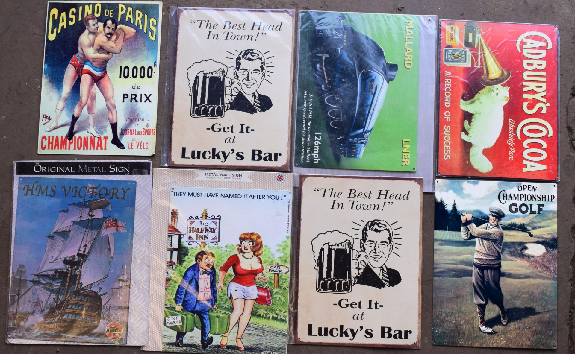 Eight metal advertising signs to include Cadbury's, golf, Lucky's bar etc, each approximately 40 x