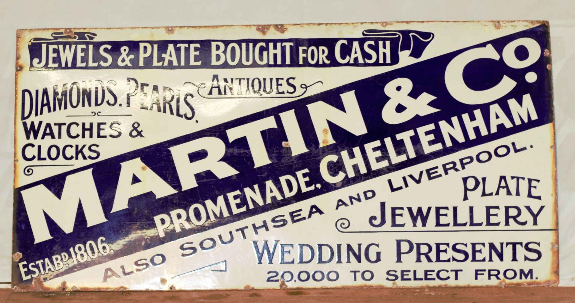 Vintage enamel advertising sign for Martin & Co. Cheltenham, 76 x 152cm PLEASE NOTE this lot is