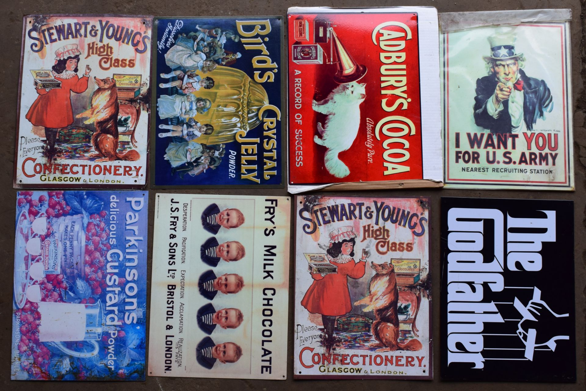 Eight metal advertising signs to include Cadburys, Birds and Fry's, each approximately 40 x 30cm