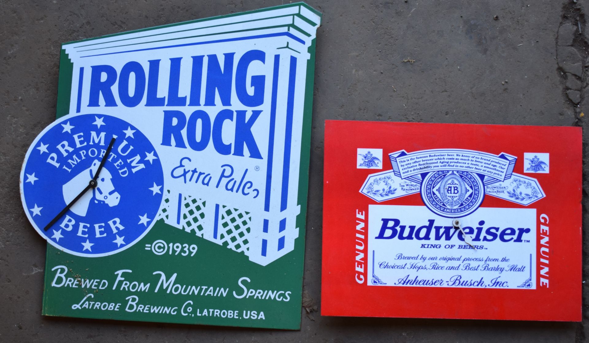 Rolling Rock enamel beer advertising clock and a Budweiser example, largest 50 x 45cm PLEASE NOTE