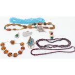 A collection of costume jewellery including garnet necklace, silver ring, agate necklace, pressed