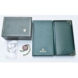 Rolex watch box with suede interior, chronometer charm, Oyster anchor charm and 2011 diary and