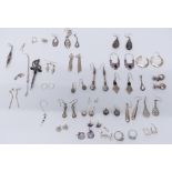 A collection of silver earrings, rings and brooches