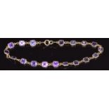 A 9ct gold bracelet set with square amethysts, 3g