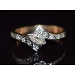 A 9ct gold ring set with a marquise cut diamond and further diamonds to the shoulders, 1.9g, size I