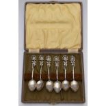 Cased set of white metal teaspoons with floral finials, marked 830, weight 53g