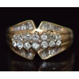 A 14k gold ring set with round and baguette cut diamonds, 6g, size O
