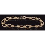 A 9ct gold bracelet made up of engraved oval links, 12.2g