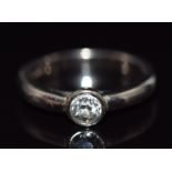 An 18ct white gold ring set with a round cut diamond of approximately 0.3ct, 4.8g, size H