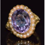 Edwardian 18ct gold ring set with an oval cut amethyst and seed pearls, London 1908, maker J.C, 5.