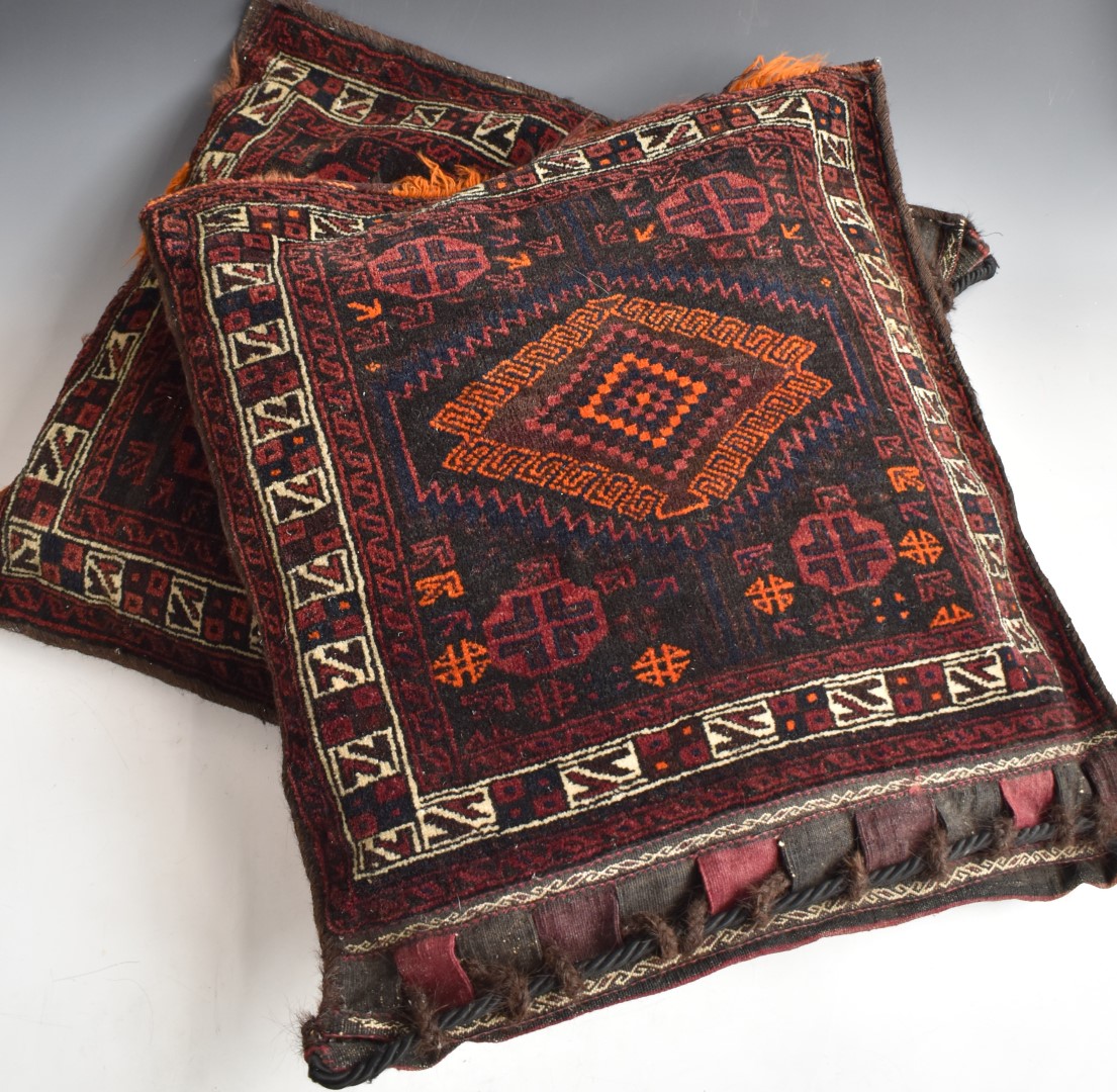 A pair of North African camel bags / cushions, 70 x 65cm