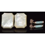 A pair of 9ct gold earrings set with jadeite and two Chinese mother of pearl buttons