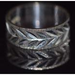 A 9ct white gold ring with bright cut decoration, 4.2g, size N/O