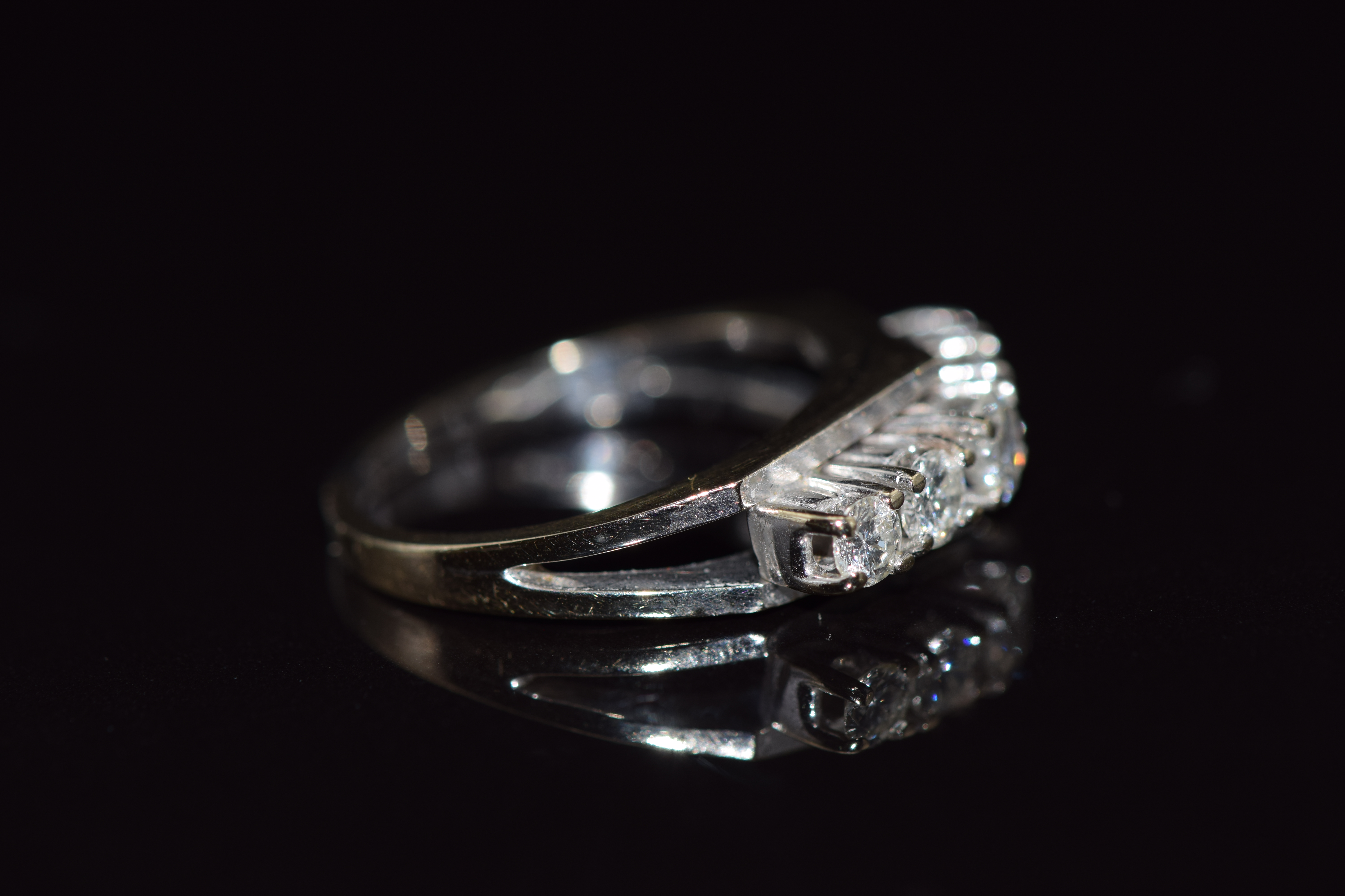 An 18ct gold ring set with five graduated diamonds in a bespoke setting, total diamond weight - Image 2 of 2