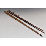Three walking sticks comprising 19th or early 20thC example with concealed telescope impressed '