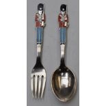 Danish sterling silver novelty spoon and fork with enamelled decoration of guardsmen with bearskins,