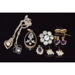 A collection of 9ct gold earrings including one pair set with a heart cut amethyst to each, two