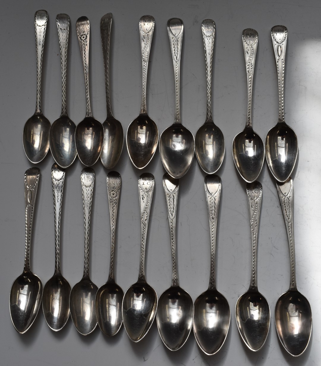 Eighteen Georgian bright cut hallmarked silver teaspoons, including a set of six bottom hallmarked