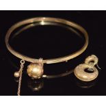 Victorian bangle with a sphere charm and a Victorian earring, 7.4g