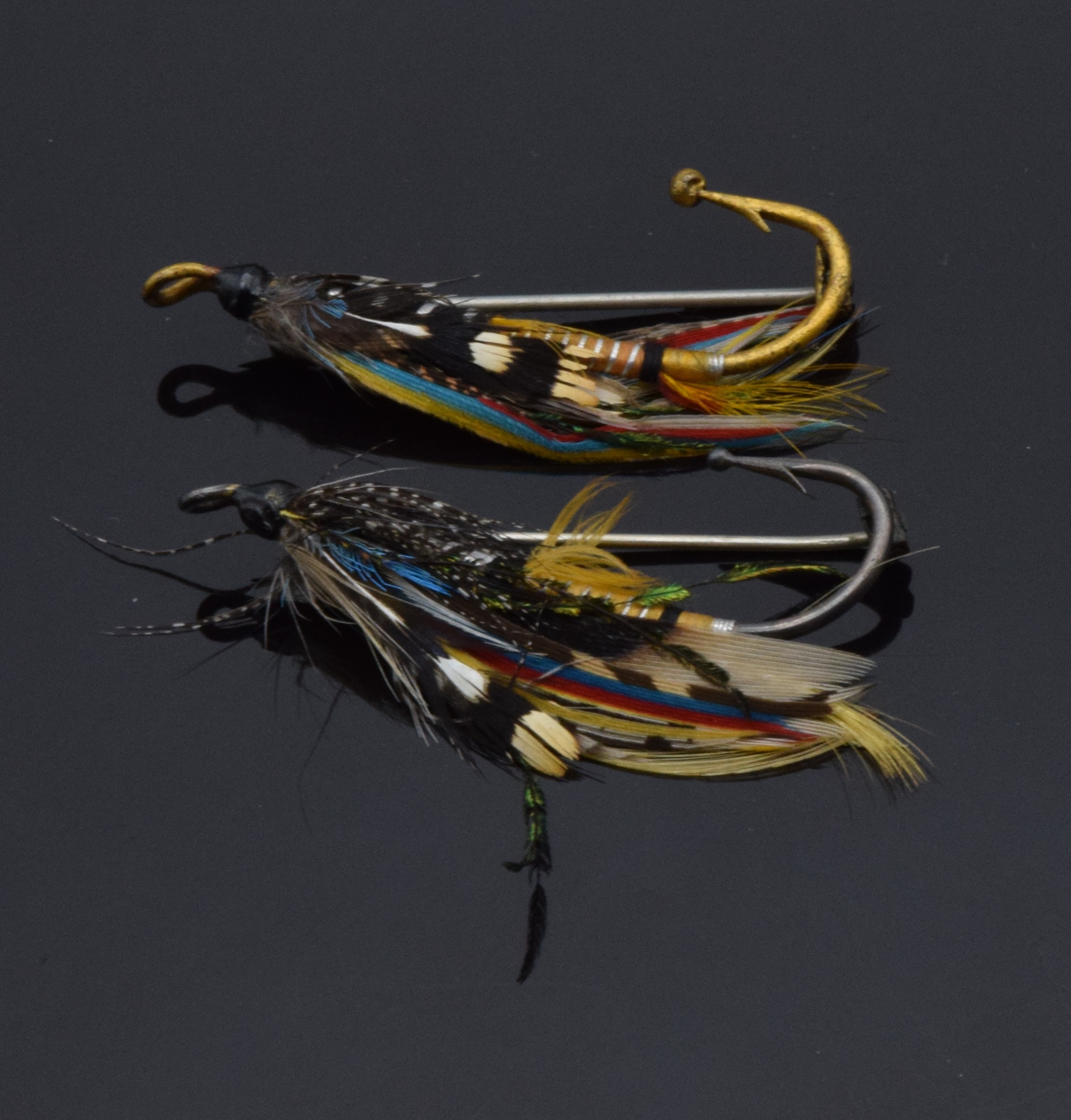 Two fly fishing brooches