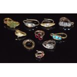 Ten pendant clips set with diamonds, rubies, pearl, garnets, enamel, turquoise, etc
