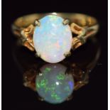 A 14k gold ring set with an oval opal cabochon, 2.5g, size N