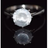 An 18ct white gold ring set with a round cut white sapphire, 3.7g, size Q