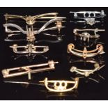 Eight gold brooch fittings, 14.8g