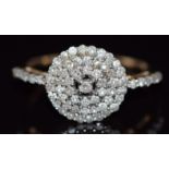 A 9ct gold ring set with diamonds in a cluster, 2.3g, size N