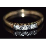 A 9ct gold ring set with three diamonds, total diamond weight approximately 0.1ct, 1.3g, size O