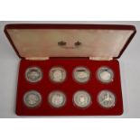 Eight Spink and Son cased Queen Elizabeth II commemorative silver crowns, various islands