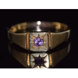 An 18ct gold ring set with an amethyst in a star setting, 4.1g, size T