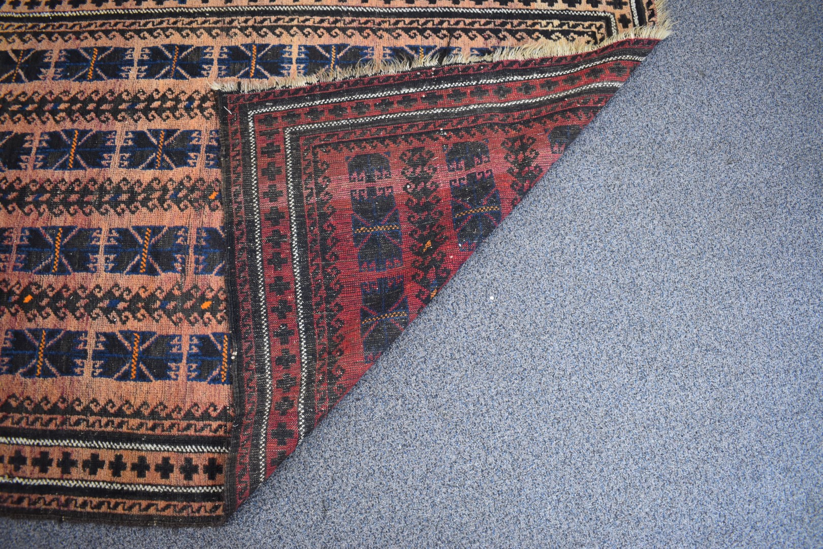Turkoman rug with four rows of nine guls on a wine ground, 197 x 111cm - Image 2 of 3