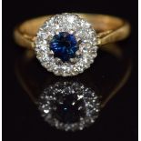 An 18ct gold ring set with a sapphire and diamonds, 3.3g, size I