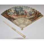 A 19thC carved ivory brise fan with hand decorated classical scene and foiled stones and a carved