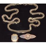 An 18ct gold watch, 15ct gold brooch set with a diamond and two sapphires (3.5g) and a curb link