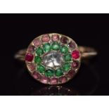 Georgian ring set with a rose cut diamond, two rubies, garnets and emeralds, size K