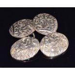 A pair of 9ct gold cufflinks with embossed foliate decoration, 3.8g