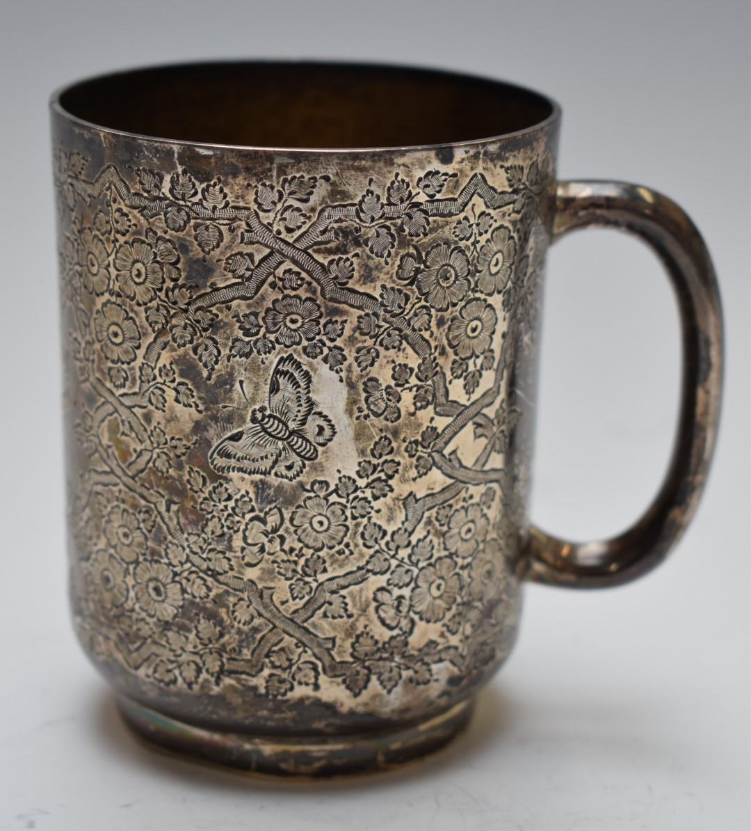 Victorian hallmarked silver tankard decorated with butterflies amongst flowers, London 1897 maker