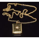 An Edwardian 18ct gold necklace / chain with an 18ct gold locket set with a diamond in a star