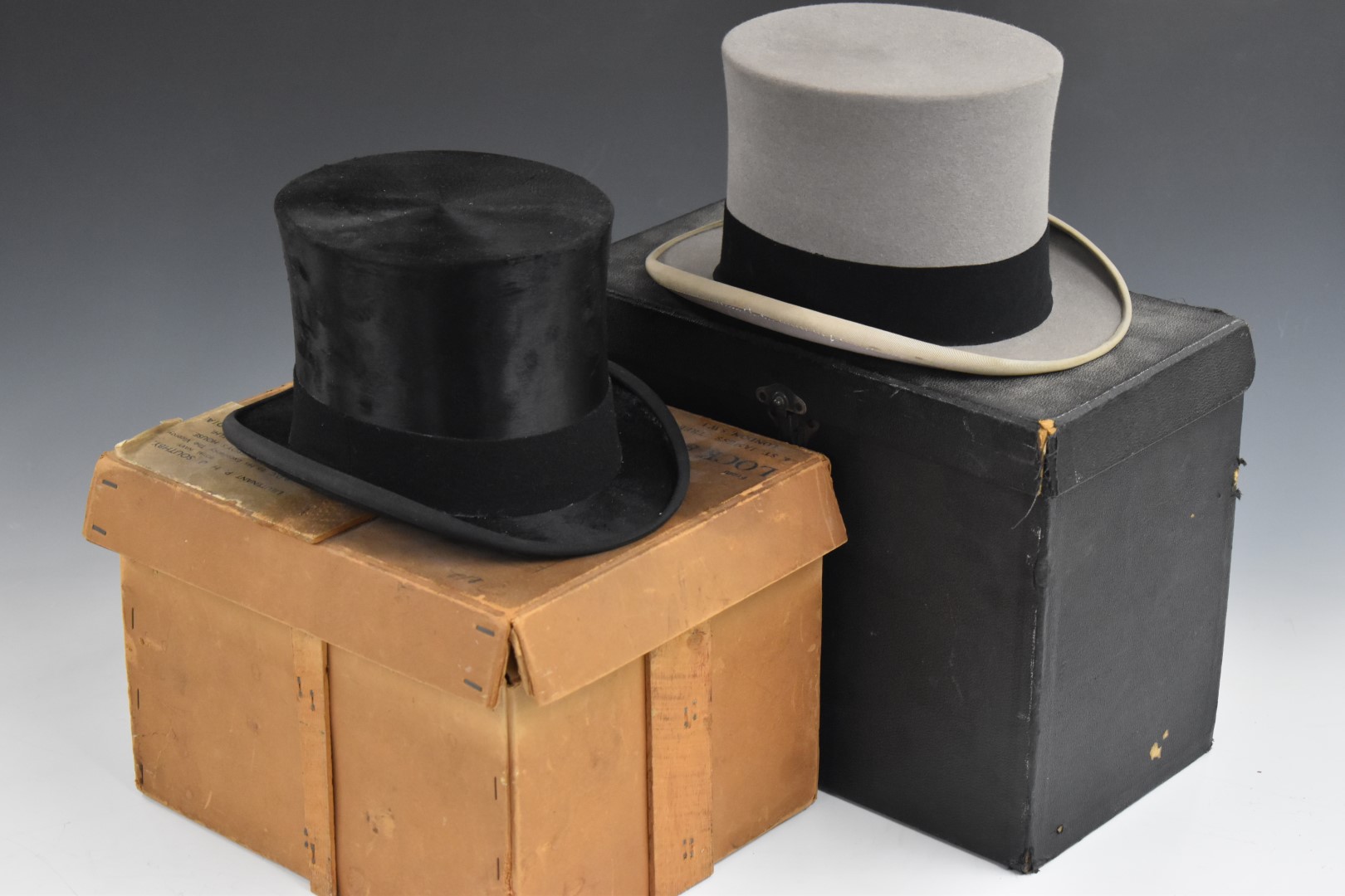 Two vintage James Lock silk top hats, one in original carry case, the other in a vintage Lock & Co