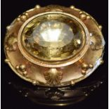 Victorian yellow metal brooch set with a large oval cut citrine, verso a glass compartment, 4 x 3.