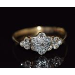 An 18ct gold ring set with diamonds in a platinum cluster, 2.4g, size M